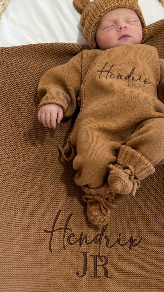 Personalized Teddy Brown newborn romper styled with the matching Classic Knit Blanket